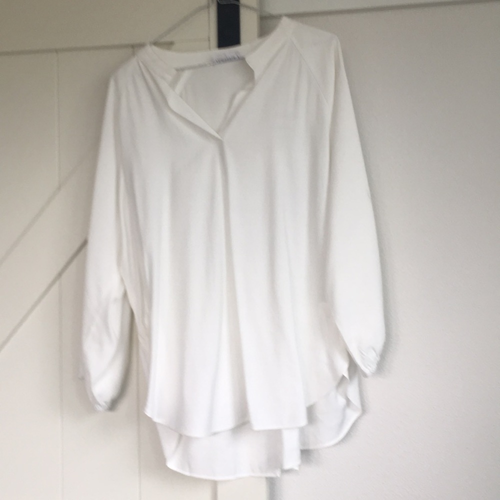 Women’s cram/white blouse